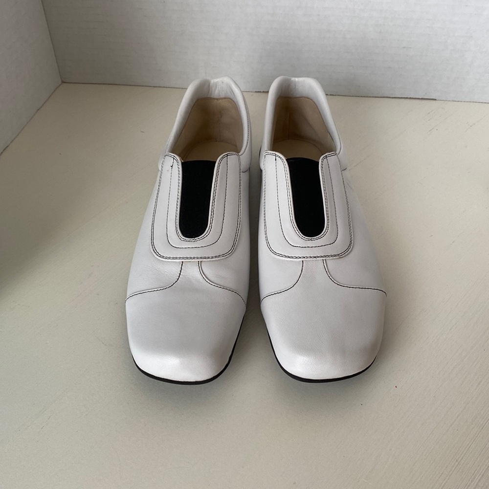 Bruno Magli leather flats. Never Worn. White with Black trim. Made in Italy.